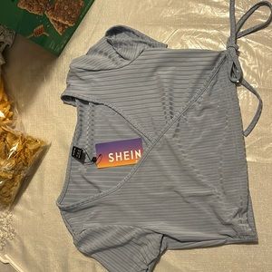 I am selling a shirt, Color is dusty blue, brand is SHEIN, Size is large.